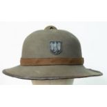 A WW2 2nd Pattern German Africa Corps Pith Helmet with insignia.