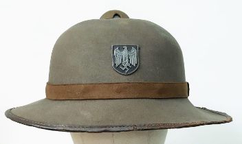 A WW2 2nd Pattern German Africa Corps Pith Helmet with insignia.