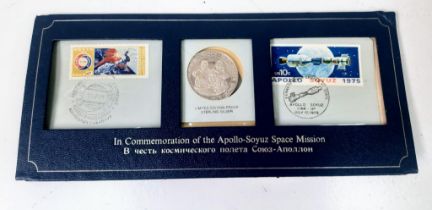 A 1975 Commemorative Apollo-Soyuz Space Mission Medal and Stamp Set.