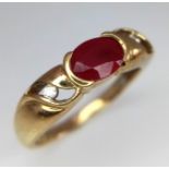 A 9k yellow gold ruby and diamond ring. 2.4g total weight. Size O (dia: 0.04ct/ruby: 1ct).