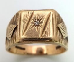 A Vintage 9K Yellow Gold Gents Signet Diamond Ring. Small round cut diamond set in a star formation.