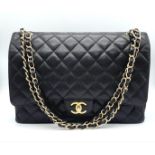 Chanel Maxi Double Flap Caviar Black Bag. The Maxi double flap bag is one of the largest sizes