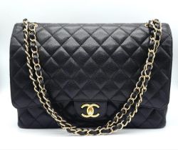 Chanel Maxi Double Flap Caviar Black Bag. The Maxi double flap bag is one of the largest sizes