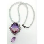 A Stunning 49ct Amethyst Gemstone Drop Pendant with an intricate 1.5ctw Diamond halo - It comes with