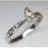 9K Marquise Cut Diamond Ring Flanked by Diamond Accents. WEIGHT: 2.41g