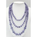 A Rope Length Graduated Lavender Jade Bead Necklace. Perfect for different wearing arrangements.