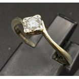 A 9K White Gold Diamond Twist Shoulder Ring. Size J/K, 0.15ct, 1.5g total weight.