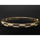 An18kt Yellow Gold Diamond & Sapphire Bangle.0.50ct Diamonds 0.65ct Sapphires W: 13.7g