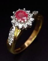 An 18K Yellow Gold Diamond and Ruby Ring. Central oval ruby with a diamond halo. Diamonds on