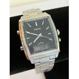 Gentlemans PULSAR QUARTZ WRISTWATCH VO72-X011 . Finished in stainless steel silver tone, Square