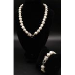 A very elegant, French designer style, natural, cultured, white pearl and cubic zirconia necklace