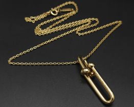 A TIFFANY & CO HARDWEAR INTERLOCK LINK PENDANT ON 18K YELLOW GOLD CHAIN, PENDANT DROP 32mm and chain