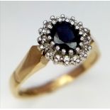 A 9k yellow gold diamond and sapphire ring. 3.3g total weight. Size O (sapp:0.60ct/dia:0.16ct)