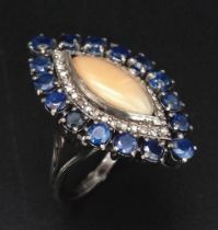 A Marquise Cut Australian Fire Opal Ring, with a Halo of Diamonds and Kyanite. 925 Silver. Size N.