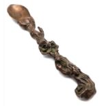 A very collectable, antique, Oriental, heavily ornate, bronze tea spoon. Length: 19 cm, weight:
