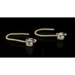 A Pair of 14K White Gold Diamond Stud Earrings. 0.16ctw.