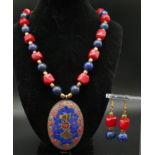 A fashionable, Nepalese, ethnic, necklace and earrings set with lapis lazuli and red coral. Necklace