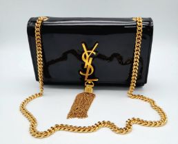 A Saint Laurent 'Kate' Tassel Crossbody Bag. This classic black patent leather bag features a sturdy