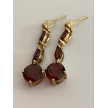 A pair of 9 carat GOLD and GARNET EARRINGS, Consisting drop style earrings with each earring