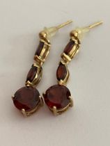 A pair of 9 carat GOLD and GARNET EARRINGS, Consisting drop style earrings with each earring