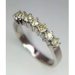 A WGI certified 18K white gold 7 stone round brilliant cut diamond ring. Diamonds - 0.50ct. Size