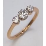 A Vintage 18K Yellow Gold Diamond Ring. Three quality brilliant cut round diamonds. Size O. 2.3g