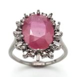 A 5ct Ruby Gemstone Ring with .60ct Diamond Accents. Set in 925 Silver. Size N. Comes with a