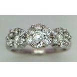 AN 18K WHITE GOLD DIAMOND TRIPLE CLUSTER RING WITH APPROX 0.60CT DIAMONDS IN FLORAL DESIGN, WEIGHT