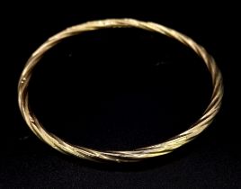 A 9K GOLD TWIST BANGLE . 3.8gms 7cms DIAMETER