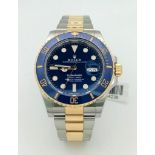 A SUPERB UNWORN ROLEX SUBMARINER IN BI-METAL WITH BOX AND PAPERS, 2020 MODEL.