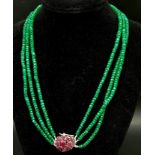 A Three Row Emerald Necklace with a Ruby and 925 Silver Clasp. 47.5cm in length, 250ctw emeralds,