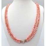 A Two Strand Knotted Coral Necklace with a 925 Silver Vermeil Clasp with Pearl Centre. Length of