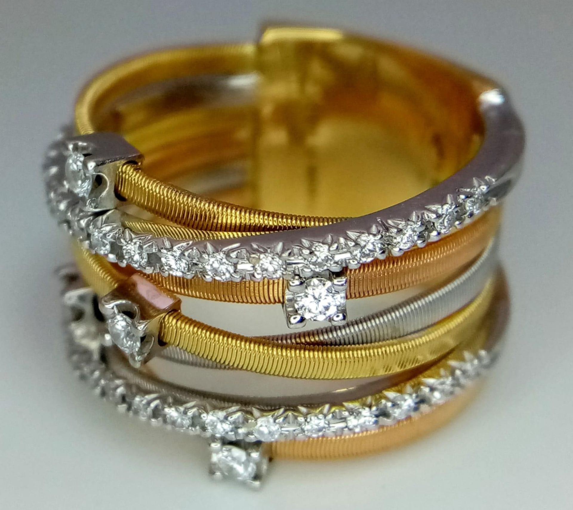 An Italian 18K Yellow and White Gold Diamond Orbital Ring. Front band of gold interspersed with - Bild 5 aus 10