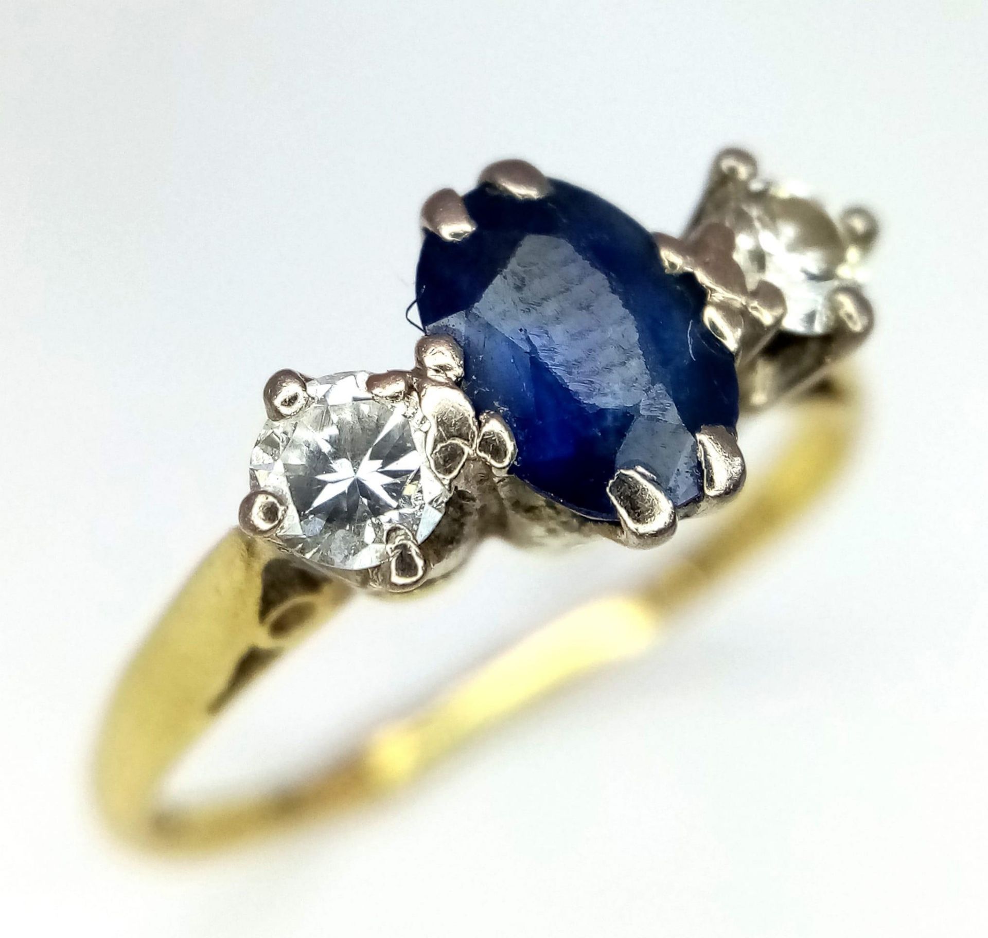 18kt Yellow Gold Diamond & Sapphire 3 Stone Ring. 0.65ct Oval Sapphire 0.20ct Diamonds W: 2.2g