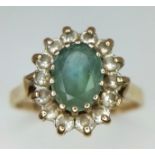 A Vintage 9K Yellow Gold Aquamarine and White Stone Ring. Size P. 3.1g total weight.