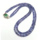 A Two Row Tanzanite Gemstone Necklace with an Emerald and 925 Silver Clasp. 45cm in length, 175ctw