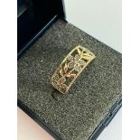 9 carat GOLD and DIAMOND RING in unusual cut out style. Complete with ring box. 2.5 grams. Size N.
