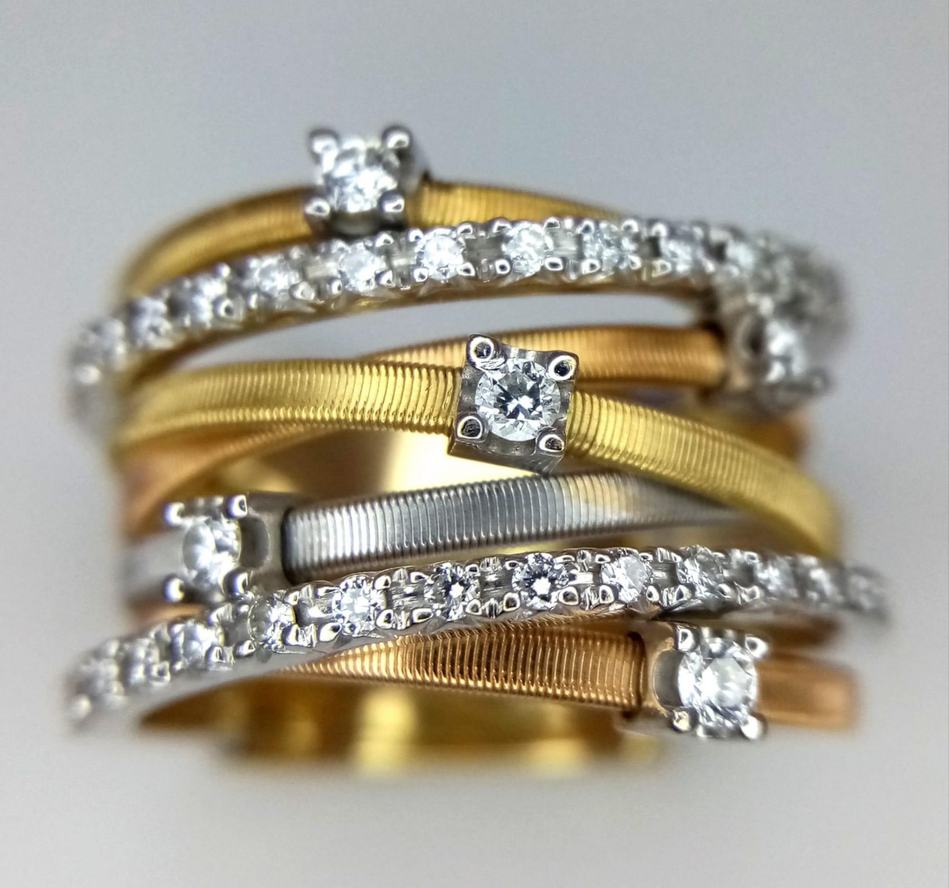 An Italian 18K Yellow and White Gold Diamond Orbital Ring. Front band of gold interspersed with - Bild 3 aus 10