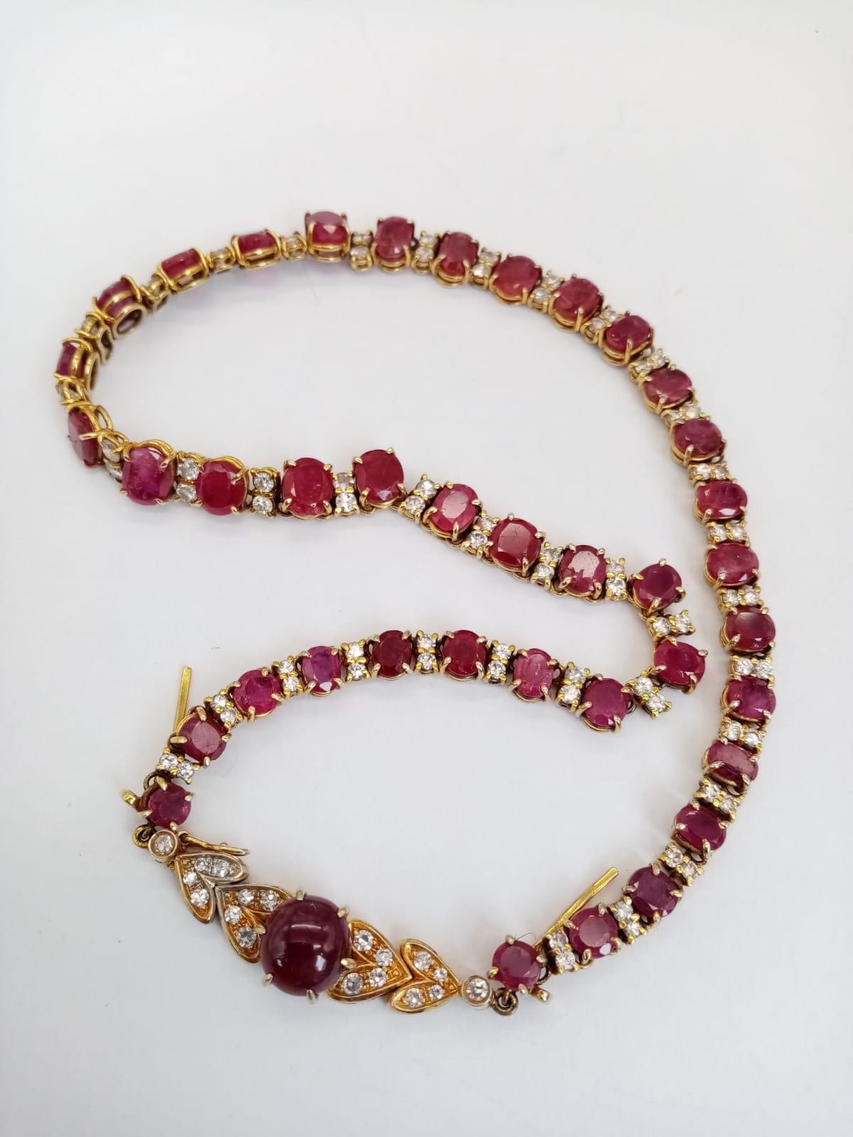 A vintage, 9 K yellow gold necklace loaded with oval cut natural rubies and round cut diamonds. - Image 2 of 10