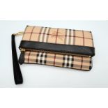 A BURBERRY HAYMARKET Check Adeline Fold over Clutch. This stylist clutch is crafted of classic