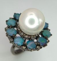A Sterling Silver, Pearl and Opal Ring. A 20ct central pearl with a halo of 4.7ct of opals. Size O/