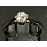 An 18K White Gold Diamond Claw Solitaire Ring with a Round Brilliant Cut Diamond. Size K 1/2, 0.