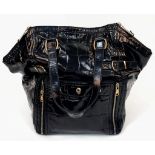 A Yves Saint Laurent Black Patent Leather "Downtown Paris" Tote Bag. It has two top handles, hand