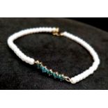 A Seed Pearl and Blue Diamond Five-Stone Bracelet. 0.3ctw of blue diamonds. 17cm. 14k gold clasp.