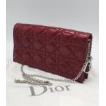 A Christian Dior Red 'Lady Dior' Bag. Cannage quilted patent leather exterior. Magnetic closure,