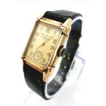 A Vintage Gold Plated Bulova Ladies Tank watch. Black leather strap. Gold plated case - 21mm x 36mm.