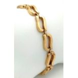 A VERY ATTRACTIVE ITALIAN DESIGNER 9K GOLD BRACELET WITH SAFETY CHAIN . 11.3gms