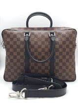 A Louis Vuitton Damier Business Bag. Damier ebene leather exterior. Rolled leather handles and trim.