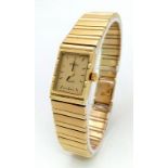 A 14K GOLD "GENEVE" SWISS MADE LADIES WATCH WITH SOLID 14K GOLD STRAP , QUARTZ MOVEMENT , GOLDTONE