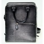 A Berluti Black Leather Satchel. Exterior in scritto leather design with zipped pocket. Spacious